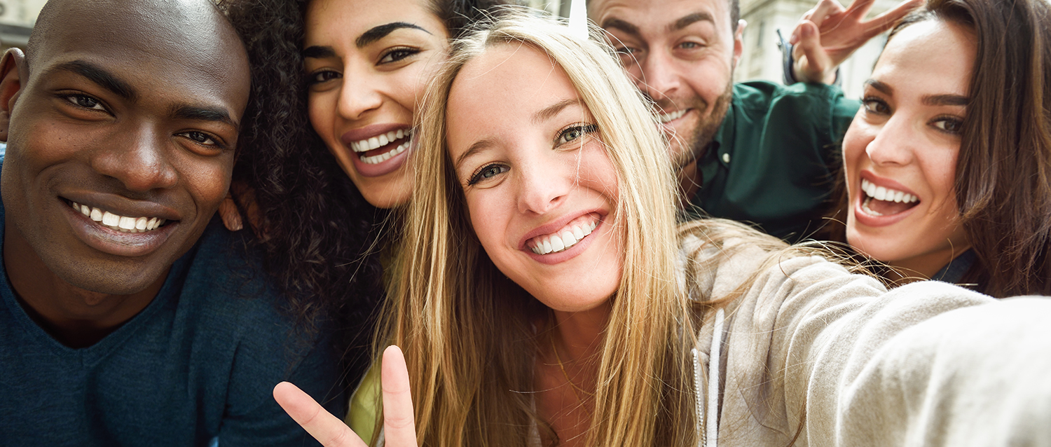 Multiracial group of young people taking selfie